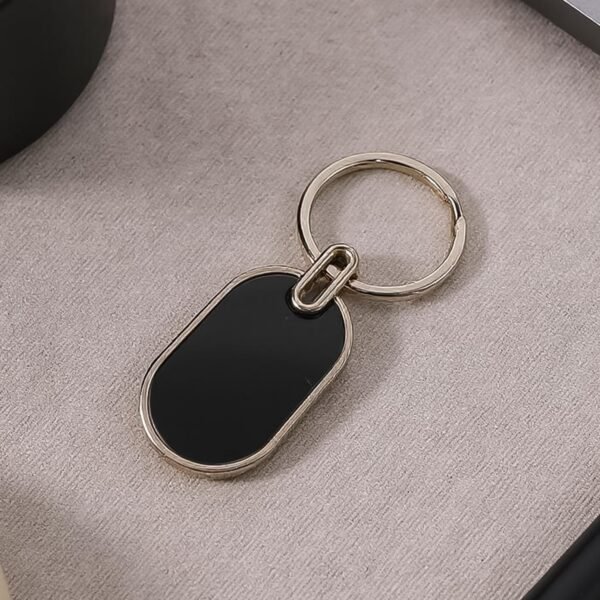 Elegant Black & Silver Oval Metal Keychain (1 Pc)