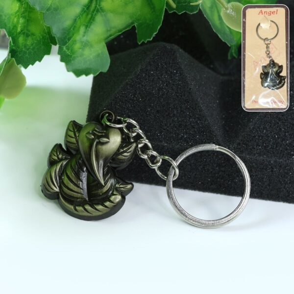 01_624b2823-ee89-42c5-99a4-6df5b565b4fd.jpg Ganesh Face Antique Black Metal Keychain (1 Pc)