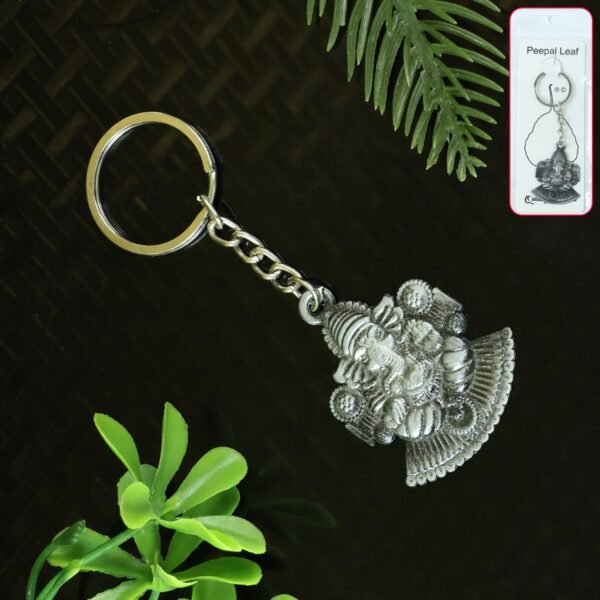 01_keychain_0c877d69-8ec6-4327-b97f-dddc1dc87a80.jpg Lord Ganesha Sitting Design Silver Keychain (1 Pc)