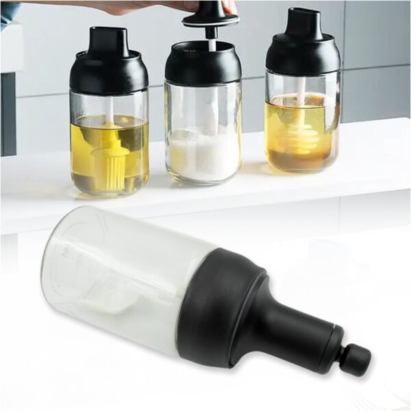 03_cadaa3c0-a61e-420e-8daf-ded257266648.jpg All-in-One Seasoning Jar: Heat-Resistant Glass with Spoon (1 Pc)