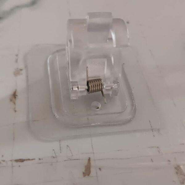0430b06e-ab32-43df-9038-762e3a1a5570.jpg Wall Mount Transparent Self-Adhesive Clip with Strong Spring Grip