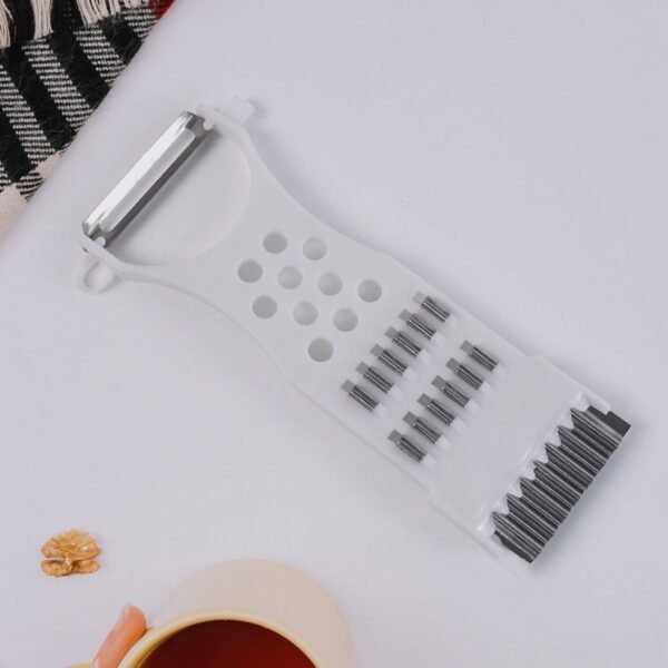 04_7a894dfa-a15c-47ae-9c16-a5a144d6ed62.jpg 4-Piece Kitchen Cutting Set: Scissors, Peeler, Grater / Slicer, and Knife