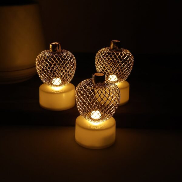 04_d6ab8c22-19d1-4e31-aa1a-cb911e978acc.jpg Decorative Apple Shape LED Tealight Candles (12 Pc)