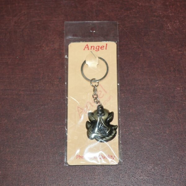 06_115fdb68-41b8-4c41-8e91-8b23dd88cfc6.jpg Ganesh Face Antique Black Metal Keychain (1 Pc)
