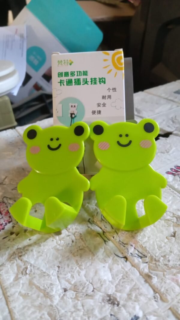 0b2b1139-4afb-47ff-ba86-3656100b5fba.jpg Plastic Adhesive Cable & Socket Holder – 2-Piece Set for Office, Home & Restaurant