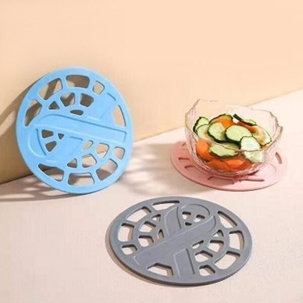 2600_6_2fc00e8d-eefb-4215-9079-3fcba78c90da.jpg 1Pc Silicone Fancy Coaster holding bowls and utensils including all kitchen purposes.