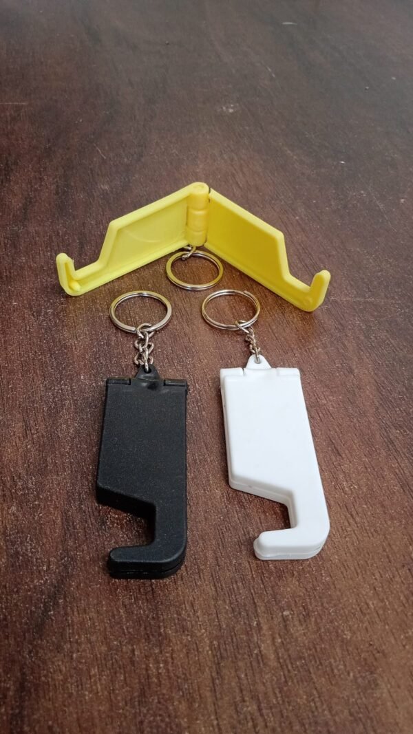 306f1290-2d0f-4526-8379-739289255201.jpg 2 in 1 Plastic Keychain with Mobile Stand / Phone Holder (1 Pc / Multicolor)