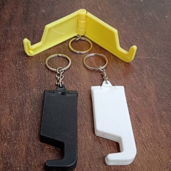 306f1290-2d0f-4526-8379-739289255201.jpg 2 in 1 Plastic Keychain with Mobile Stand / Phone Holder (1 Pc / Multicolor)