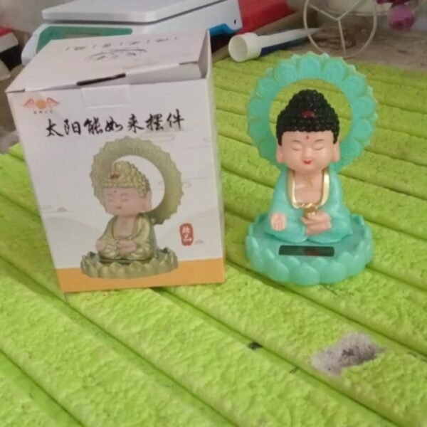 42956a2c-94bb-4643-b957-427c0f2bd345.jpg Plastic Solar Powered Moving Head Sitting Action Buddha Statue (1 Pc / Mix Color)