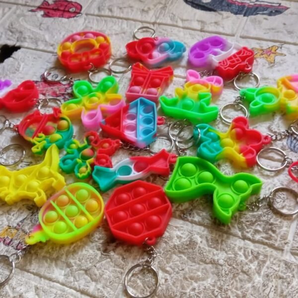 4afe7fb5-bde2-46bc-b9fa-20558cd4084c.jpg Compact Pop It Keychain – Fun Stress Relief Fidget Toy (1 Pc | Mix Design)