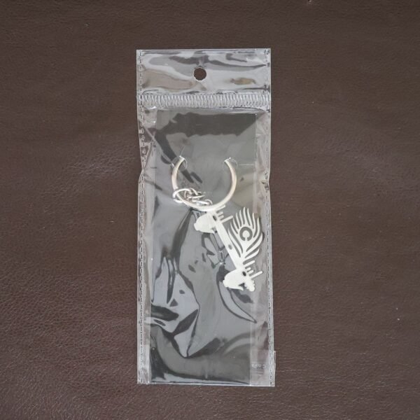 KrishnaKeychain-Liveimage.jpg Krishna Flute & Peacock Feather Metal Keychain - (1 Pc)