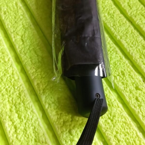 c2b1d2b2-dc47-4c76-9f83-c6e206f8cab6_447d2c9f-7892-4f9e-8e3e-70ce6b109b24.jpg 2 Fold Manual Umbrella – Wind, Sun & Rainproof with Steel Shaft & Wrist Strap