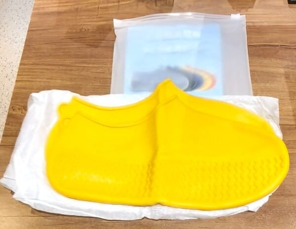d99fb606-732f-45a4-8dd3-5bc25902b7f6.jpg Yellow Non-Slip Silicone Rain Shoe Cover – Waterproof Foldable Anti-Skid (1 Pair)