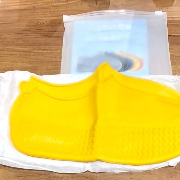 d99fb606-732f-45a4-8dd3-5bc25902b7f6.jpg Yellow Non-Slip Silicone Rain Shoe Cover – Waterproof Foldable Anti-Skid (1 Pair)