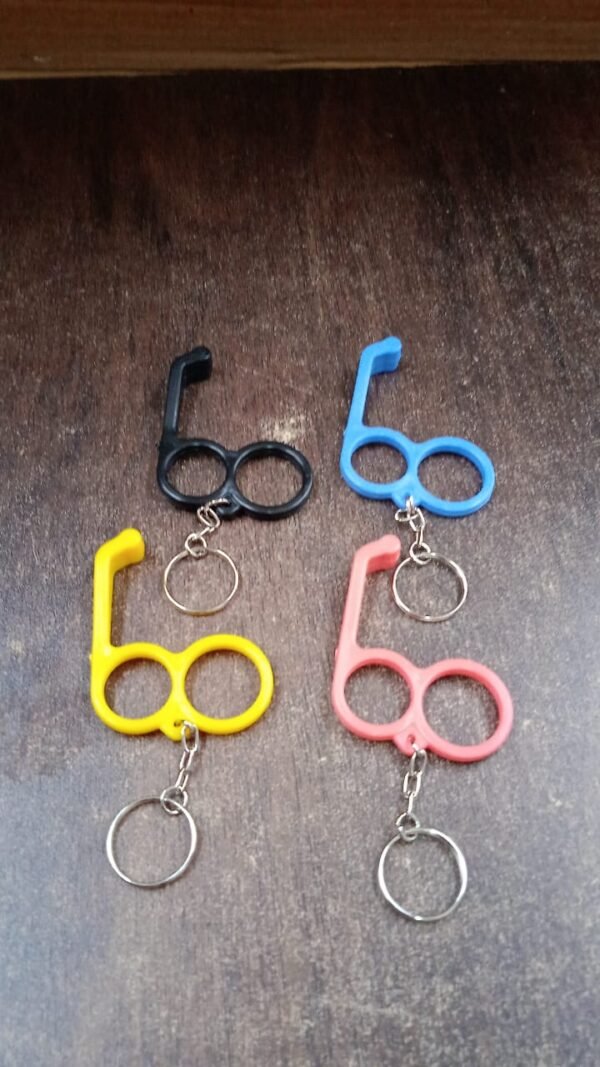 dd6d50cd-c96a-40f4-91c2-691ee16b6f01_032e84f9-fe45-4fda-8b32-5ecf65d00725.jpg 2-in-1 Plastic Dual-Finger Mobile Stand cum Keyring (1 Pc, Mixed Color)