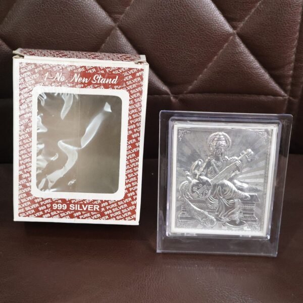 decorative-photo-frame-08_4eb2871a-af26-46d3-afe4-8b09d998b41b.jpg Elegant Silver Saraswati Maa Photo Frame with Stand (1 Pc)