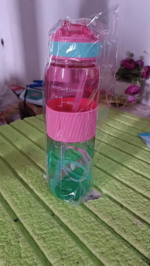 df8fc2cc-1ccf-4c33-89b5-9d72a310142f.jpg Plastic Water Bottle With Strap and Straw (1000 ML)