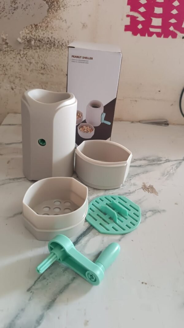 e9db5b89-739b-4679-8889-e7d4097c88cd.jpg Manual Hand-Crank Peanut Sheller Machine